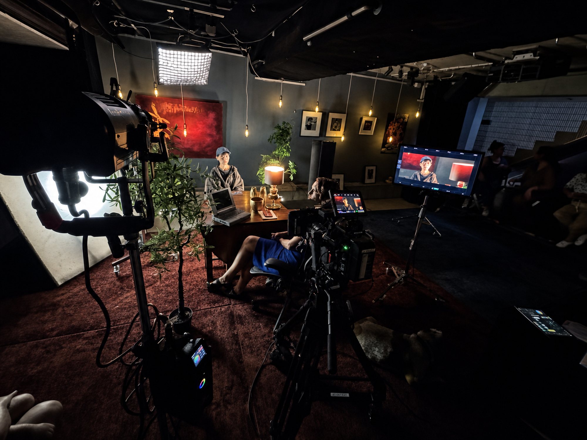Multicam studio set with monitor feeds and crew working the desk at JJ Splice