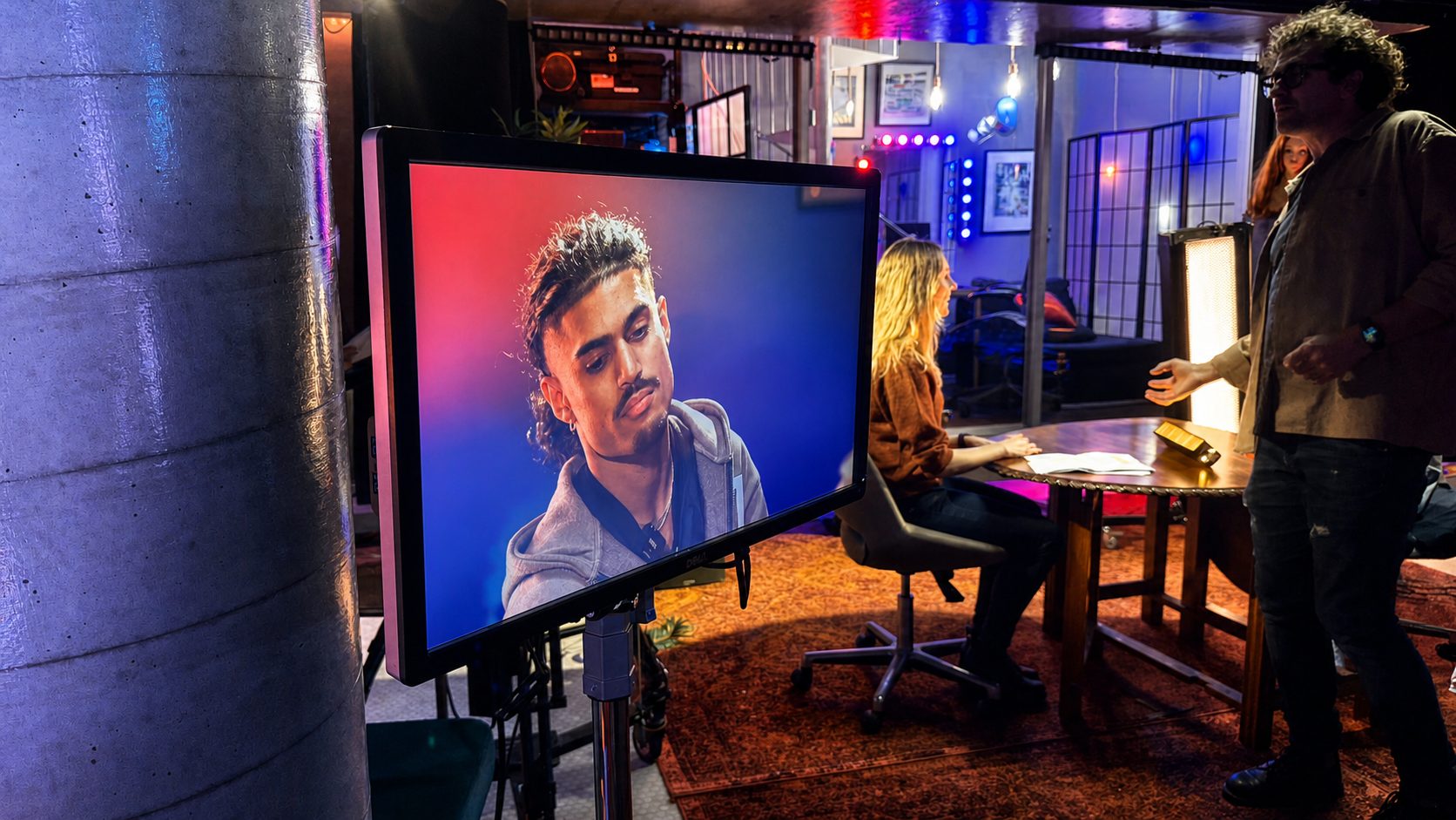 Wide shot of the JJ Splice studio with monitor and crew
