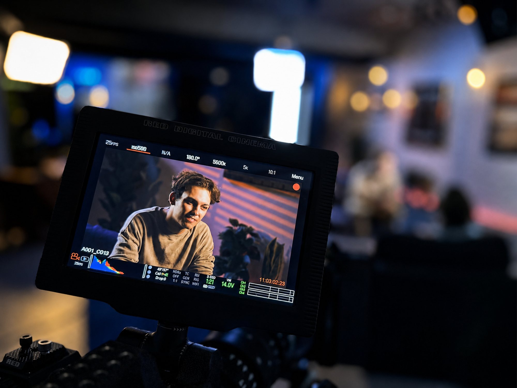 RED camera monitor showing an actor's performance close-up